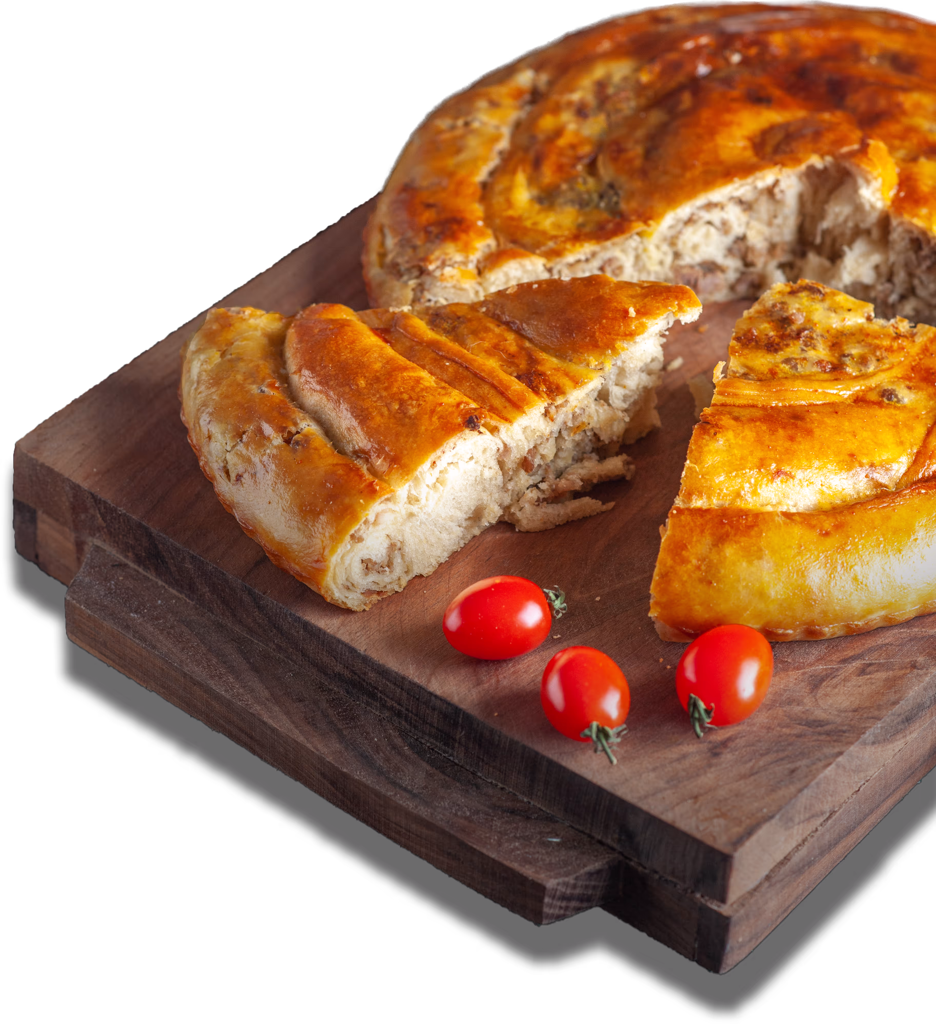 A plate of Serbian delicacy called Burek with some cherry tomatoes.